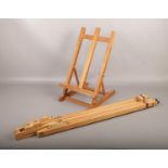 A Daler Rowney wooden artist's easel, along with a Daler table top easel.
