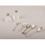 A glass scent bottle with silver collar, glass pepper pot with silver lid and five silver teaspoons