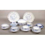 A collection of 19th century blue and white porcelain cups and saucers, slop bowl etc.