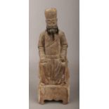 An antique Chinese carved wooden devotional figure, with original horsehair beard.