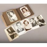 A album of monochrome photographs of actors and actresses to include autographed examples.