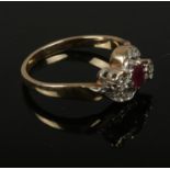 A 9 ct Ruby & Diamond crossover ring, size L, 2.7g