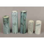 Five Carn pottery cylinder vases by John Beusmans. Including a pair decorated with tulips and one