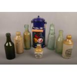 A mixed group to include stoneware, glass advertising bottles and a barge ware enamel container.