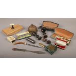 A box of collectables, to include military matchbox holder, Hohner harmonica, seals etc.