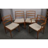 Four retro teak ladder back dining chairs, possibly G Plan, including a carver armchair.
