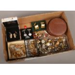 A box of assorted cufflinks, tie pins, studs etc.