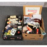 Two boxes of Guinness memorabilia to include, boxed diecast figures, beer mats, ads reel, clocks