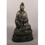 A Chinese Bronze figure of Guanyin on lotus throne (approx 50cm height).