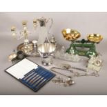 A collection of metal and glass wares, to include kitchen scales, candlesticks, cruets etc.