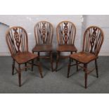 A set of four ash and elm wheelback chairs.