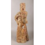 A 19th century Chinese carved wood figure of a standing immortal. (59cm).