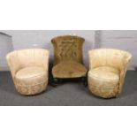 A Victorian nursing chair, along with two floral upholstered tub chairs.