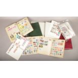 A box of loose and albums of stamps to include stamps from around the world.