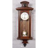 An 1880's 15 day single train wall clock GOod working order