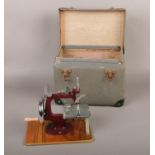 An Essex Miniature Sewing Machine with case