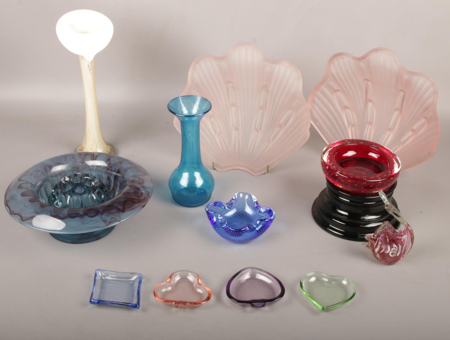 A collection of coloured glasswares, vases, shell shades, dishes etc