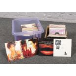 Two boxes of 45 rpm records, Bryan Adams, Sister Sledge, Annie Lennox, Whitney Houston examples
