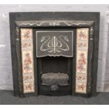 A Victorian style electric fire surround.