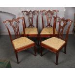 A set of four Georgian style carved mahogany Hepplewhite dining chairs.