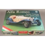 A boxed Alfa Romeo spider touring gran sport 1932 scale model kit. Box has a few minor bangs and