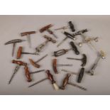 A box of vintage corkscrews, to include horn examples.