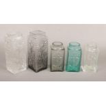 Five Dartington glass vases by Frank Thrower, three decorated in relief with daisys FT59 in white,