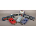 A group lot of diecast vehicles to include red tin plate example, boxed Royal Air Force set
