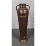 A large decorative Eastern steel urn shape vase with brass mounts. (Height 103cm).