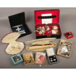 A quantity of boxed costume jewellery items and a replica George Cross medal.
