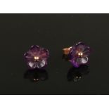 A pair of 9ct gold and carved amethyst floriform ear studs.