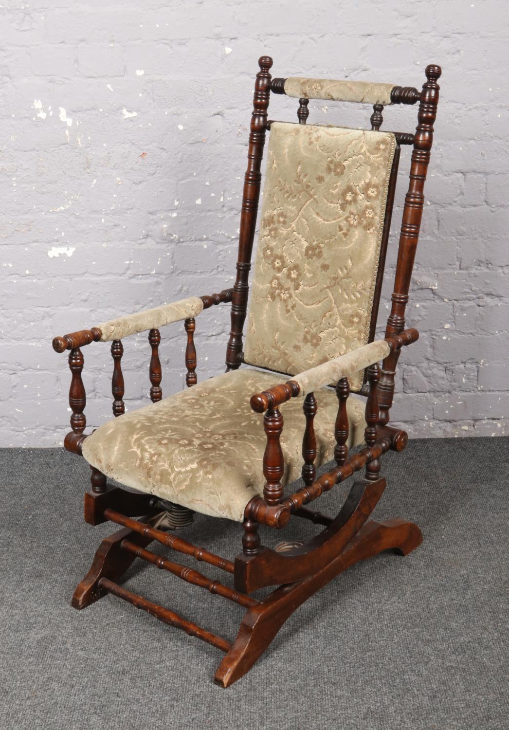A mahogany American rocking chair.