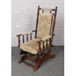 A mahogany American rocking chair.