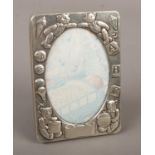 A silver photo frame engraved with teddy bears assayed Harman Brothers Birmingham 1993.