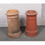 Two terracotta chimney pots.