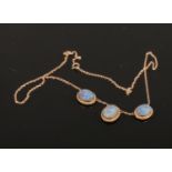 A 9ct gold opal doublet necklace set with three panels.