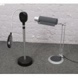 Two modern angle poise lamps, one battery powered, the other electric.