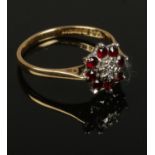 A 18 ct gold Ruby & Diamond cluster ring, size M 2.4g