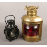 A vintage Powell & Hanmer lamp, along with a brass port lantern.