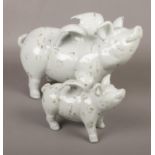 Two ceramic winged pigs