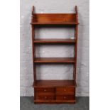 A mahogany open bookcase with four drawer base. 115cm x 53cm. Good condition no noticeable damage.