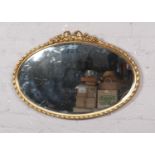 A gilt framed oval mirror