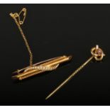 A 15ct gold and pearl bar brooch along with a 9ct gold and garnet Stafford knot stick pin.