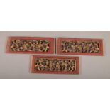 A set of three mid 19th century carved wooden panels, with double sided carving.