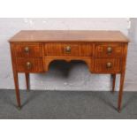 A mahogany crossbanded kneehole desk.