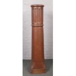 A Long Tom chimney pot (Height 148cm).
