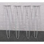 A set of four grey painted metal hairpin furniture supports (71cm).