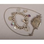 A silver charm bracelet with silver charms along with a silver RAOB pendant on chain, 75g.