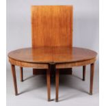 A large Regency mahogany D-end dining table with extra leaf and raised on square tapering