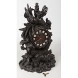 A 19th century Black Forest walnut mantel clock. Naturalistically carved with a cockerel, hen and
